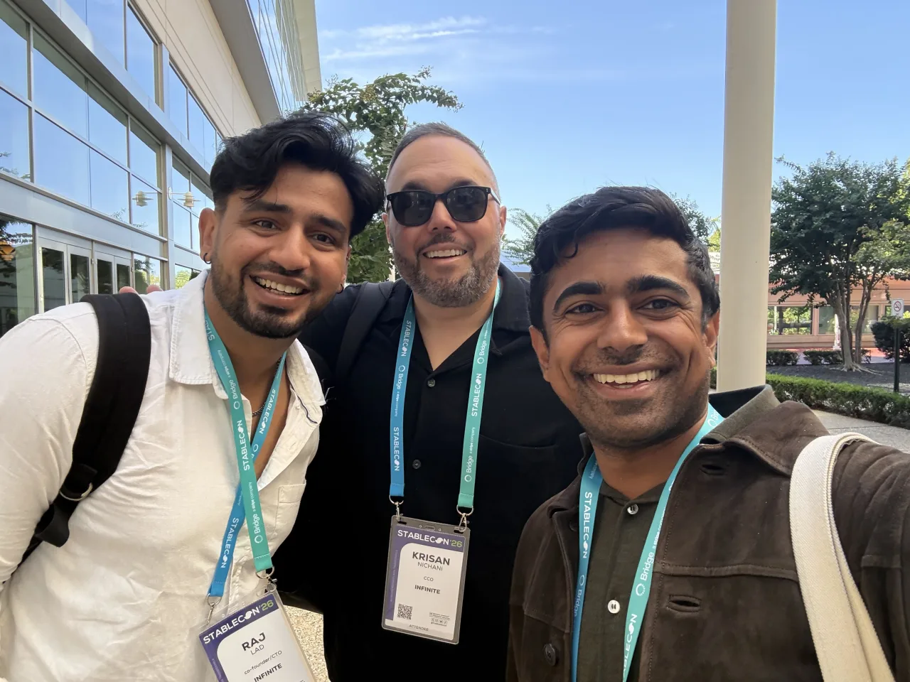 Raj Lad, Krisan Nichani, and Nikhil Srinivasan of Infinite wearing Stablecon ’26 badges outside the Gaylord National Resort at National Harbor, Washington, DC